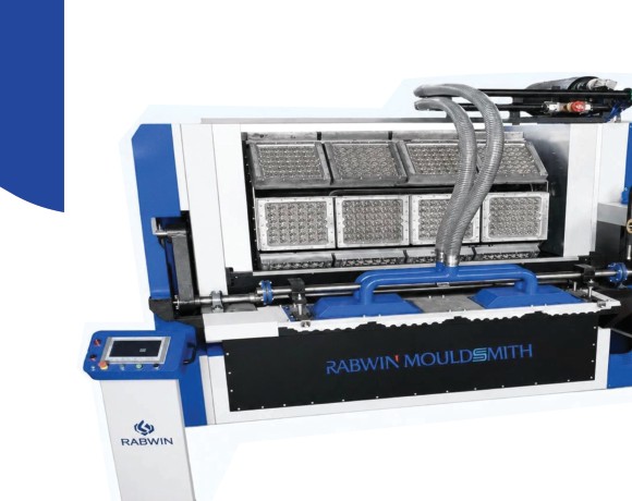 Rotary moulder egg tray machine producing moulded fibre egg trays